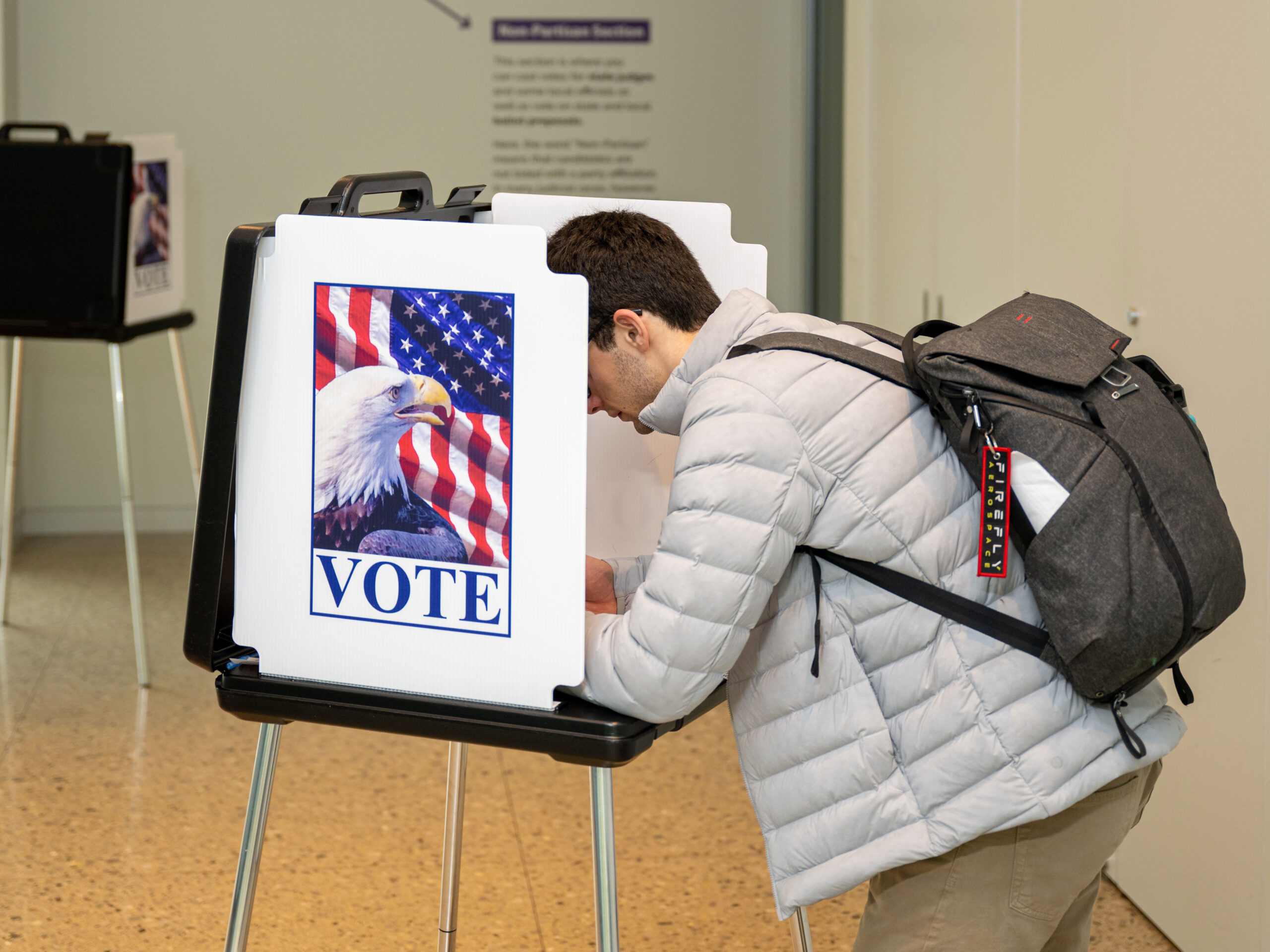Student voting at UMMA polling station