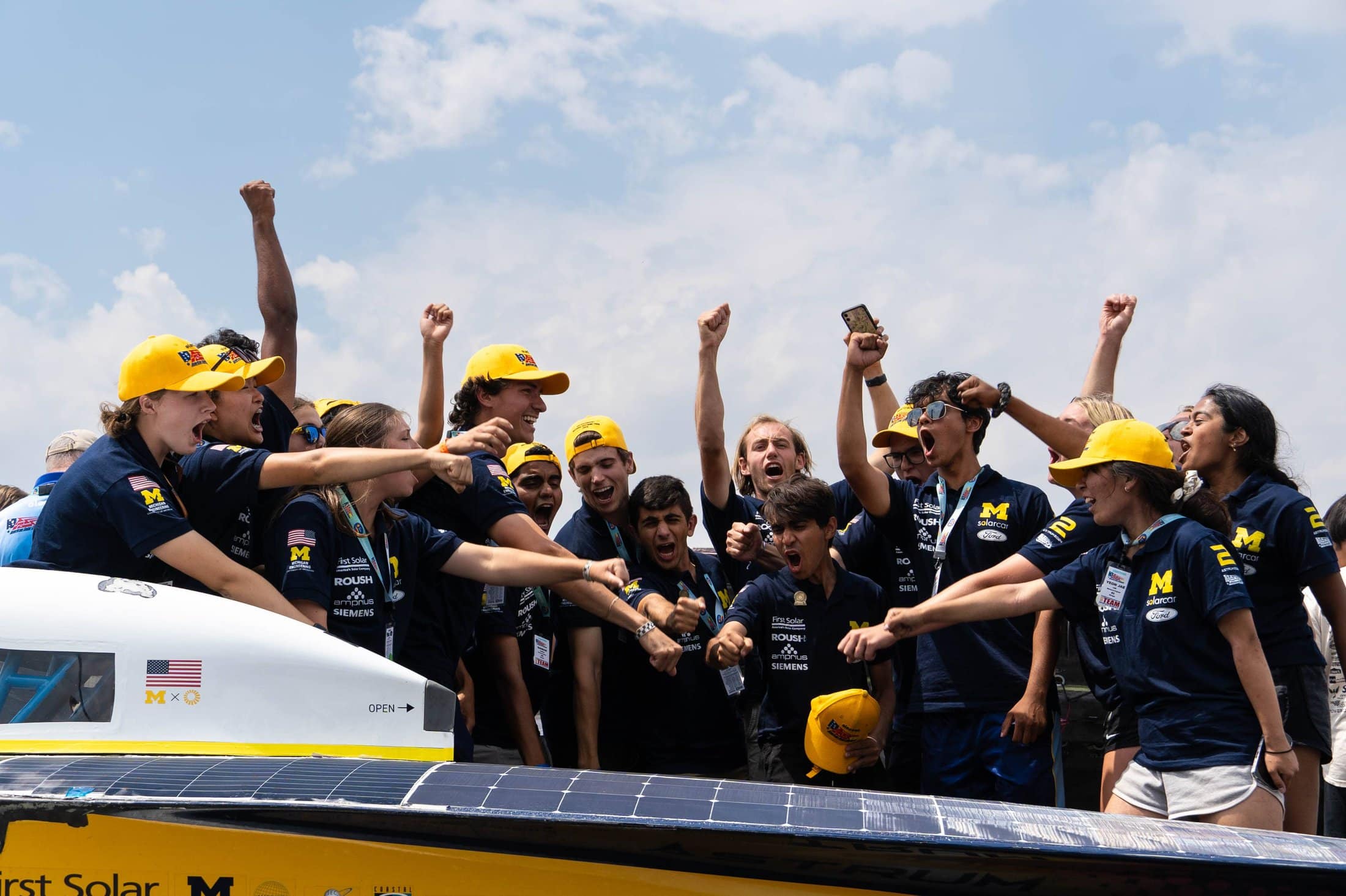 Michigan Solar Car students celebrate after winning the American Solar Challenge.