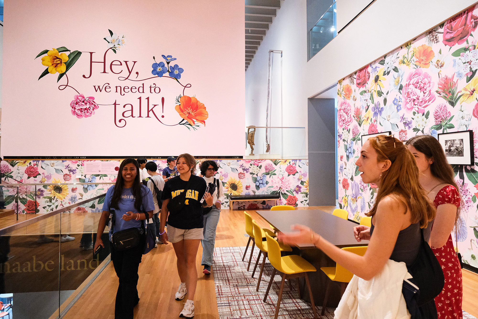 Students visit the “Hey, We Need to Talk!” exhibit at the U-M Museum of Art. The exhibit is part of a class in which students work to develop human-centered experiences to guide public policy.